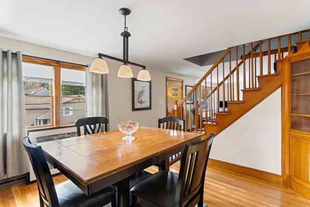 a view of a dining room with furniture window and wooden floor