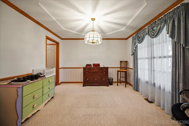 a bedroom with window and furniture