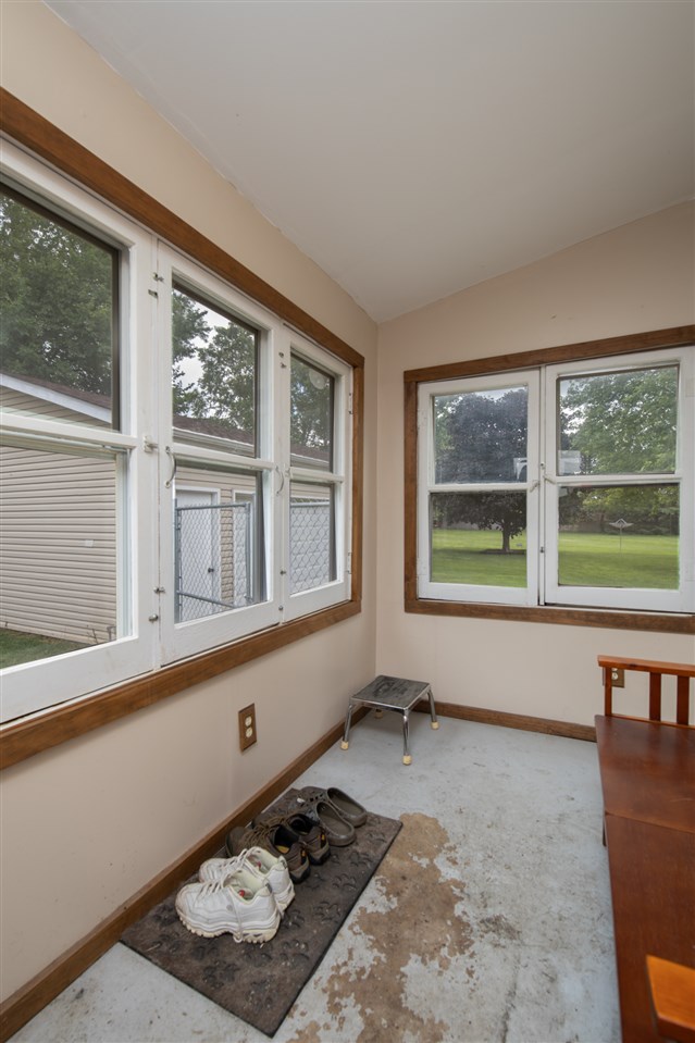 6975 Garden Prairie Road Garden Prairie, IL 61038 - Photo 11 of 28 a room with furniture and window