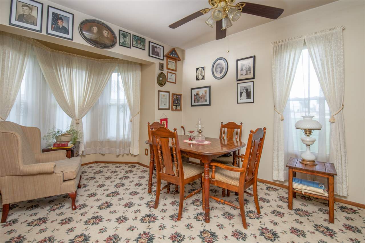 6975 Garden Prairie Road Garden Prairie, IL 61038 - Photo 12 of 28 a view of a livingroom with furniture and a window