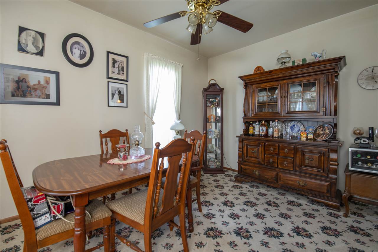 6975 Garden Prairie Road Garden Prairie, IL 61038 - Photo 13 of 28 a view of a dining room with furniture