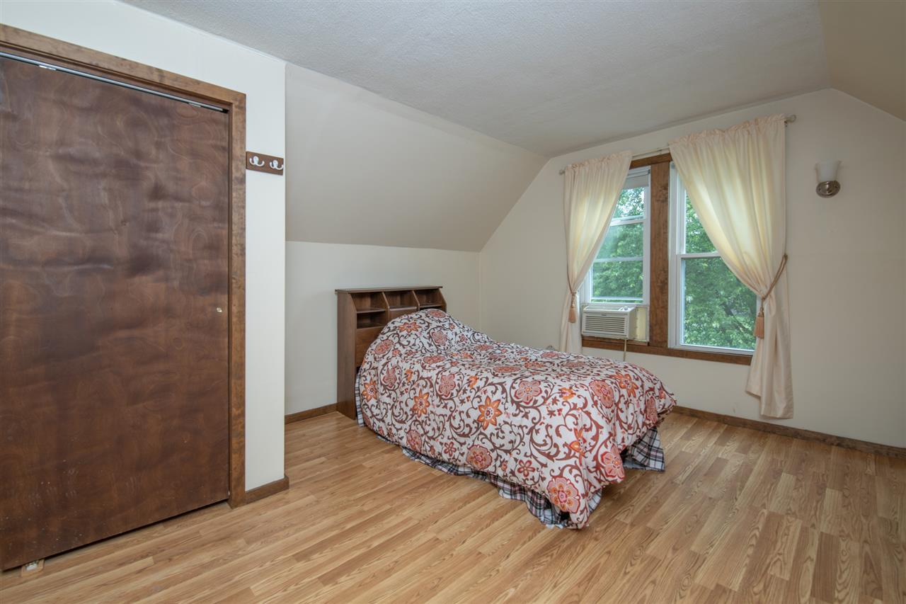6975 Garden Prairie Road Garden Prairie, IL 61038 - Photo 18 of 28 a bed sitting in a bedroom next to a window