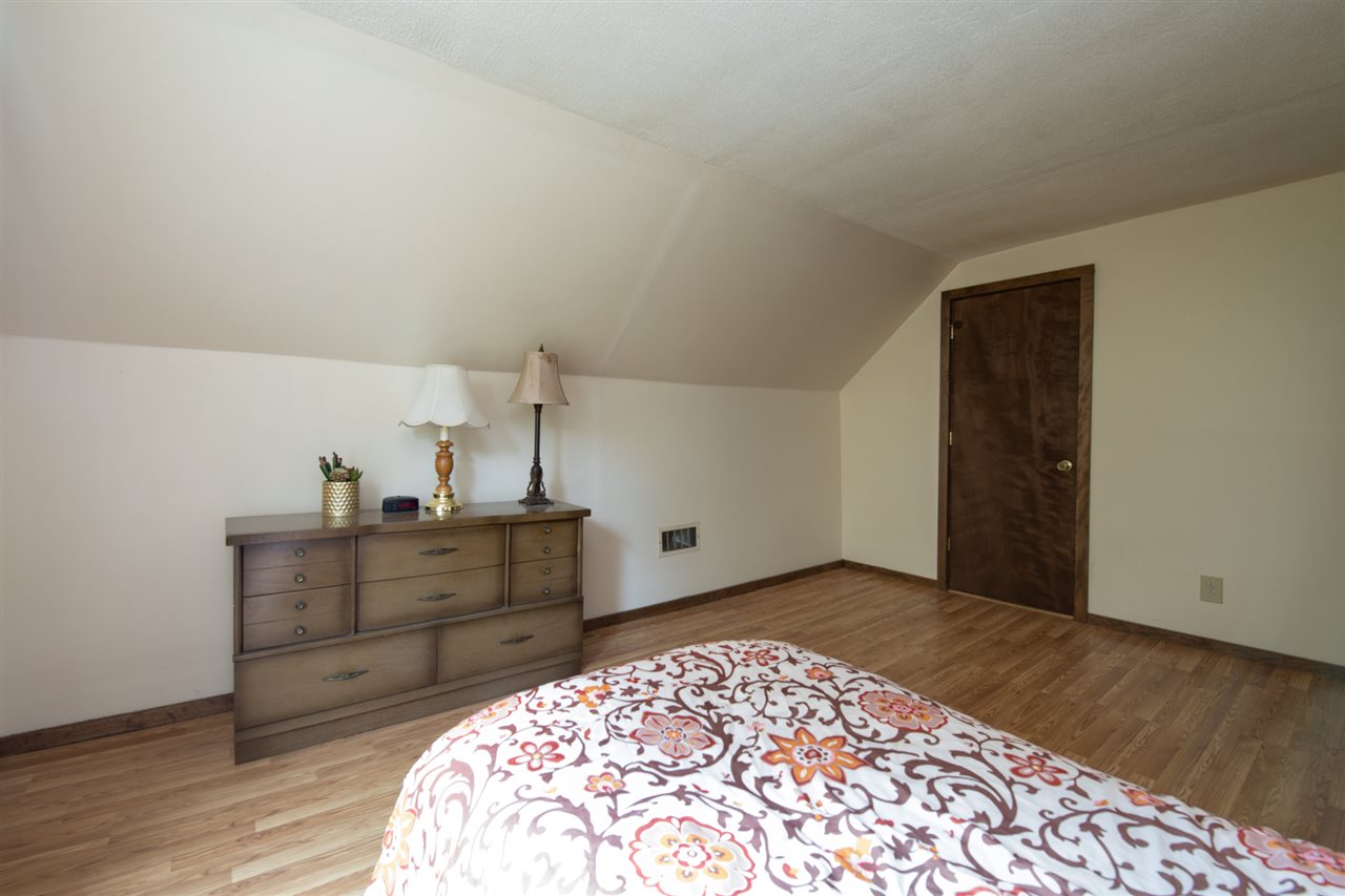 6975 Garden Prairie Road Garden Prairie, IL 61038 - Photo 19 of 28 a room with a dresser