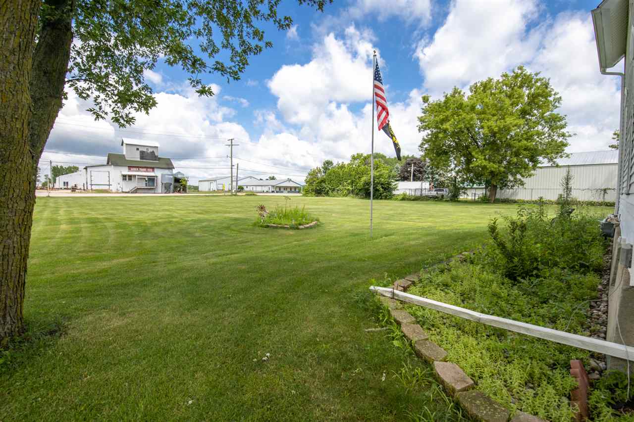 6975 Garden Prairie Road Garden Prairie, IL 61038 - Photo 28 of 28 a view of a golf course with a lake