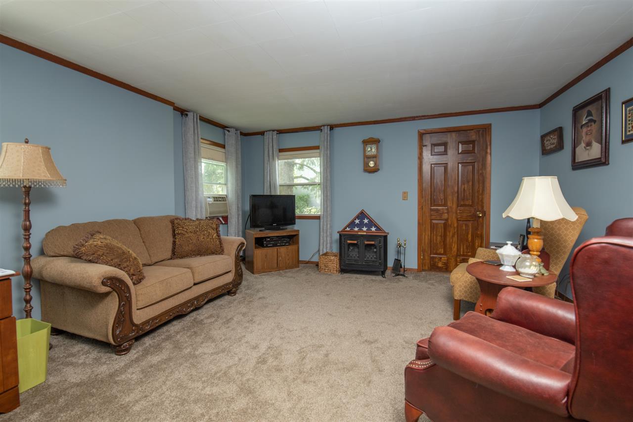 6975 Garden Prairie Road Garden Prairie, IL 61038 - Photo 4 of 28 a living room with furniture