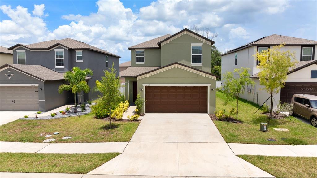 36403 Wl Hl Way Zephyrhills, FL 33541 - Photo 1 of 1 a front view of a house with yard