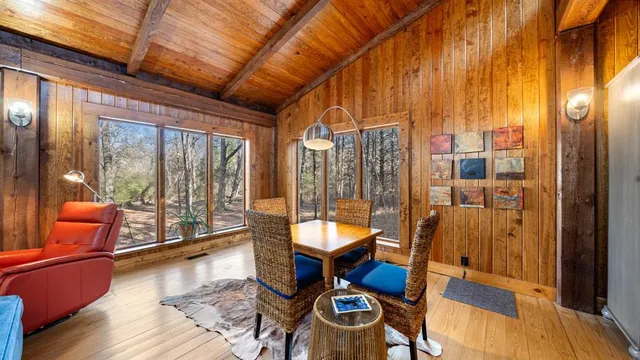 a living room with furniture and a floor to ceiling window