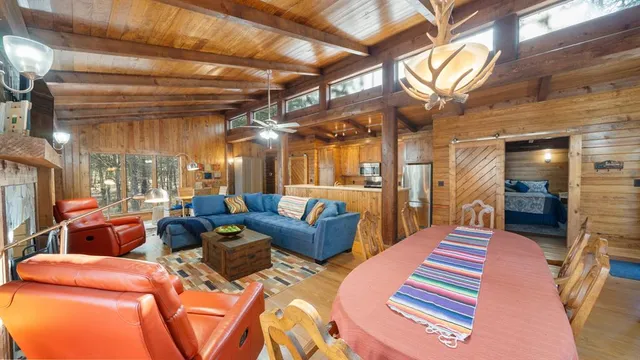 a lobby with furniture and a chandelier
