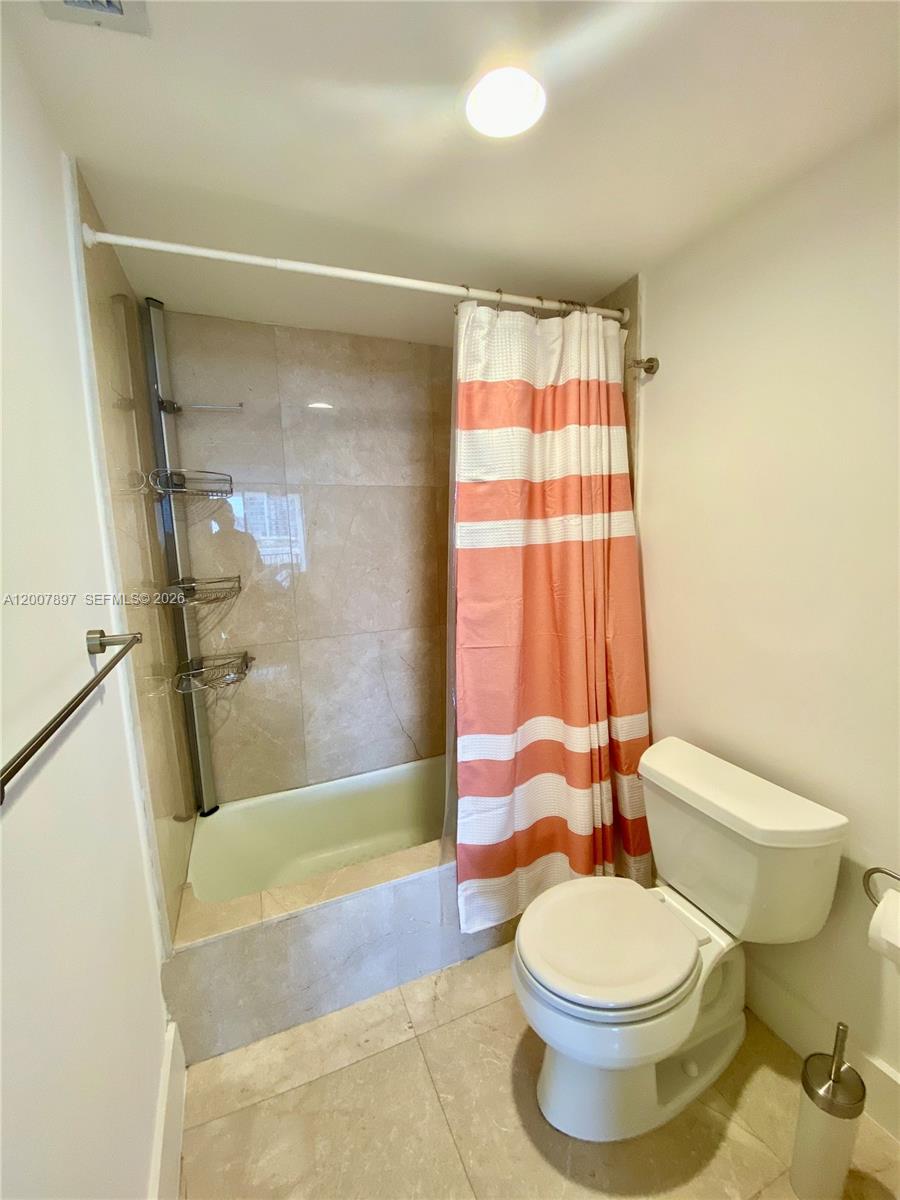 1901 Brickell Avenue, Unit B2007 Miami, FL 33129 - Photo 11 of 11 a bathroom with a toilet and a shower
