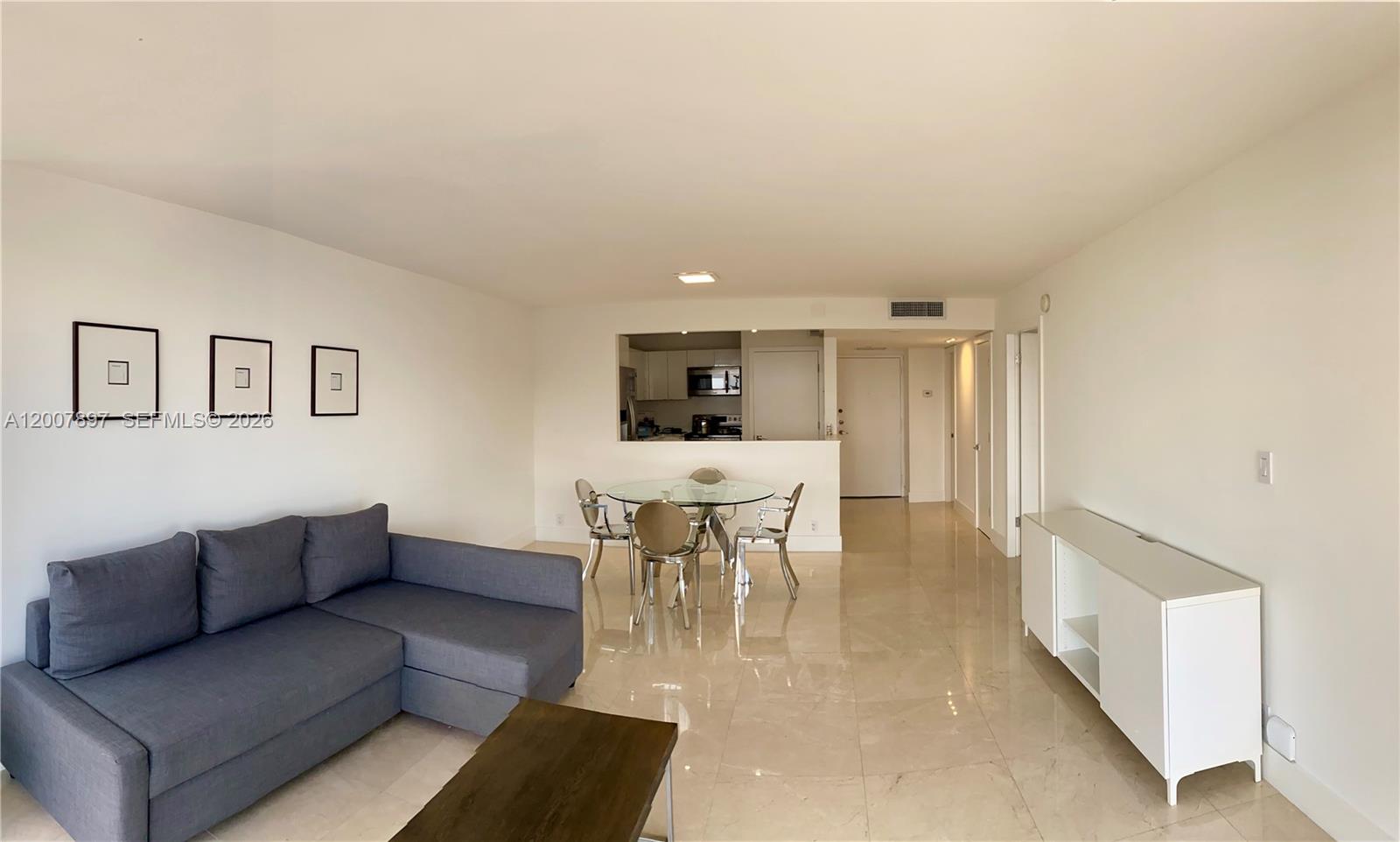 1901 Brickell Avenue, Unit B2007 Miami, FL 33129 - Photo 3 of 11 a dining room with furniture and view of kitchen
