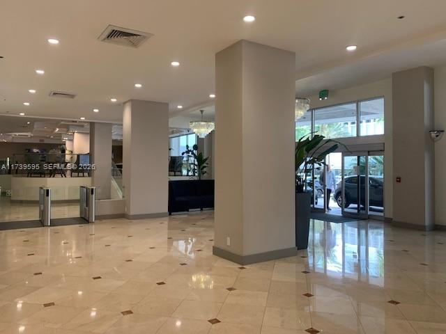 100 Lincoln Road, Unit 821 Miami Beach, FL 33139 - Photo 17 of 33 a view of a lobby with furniture and floor to ceiling window