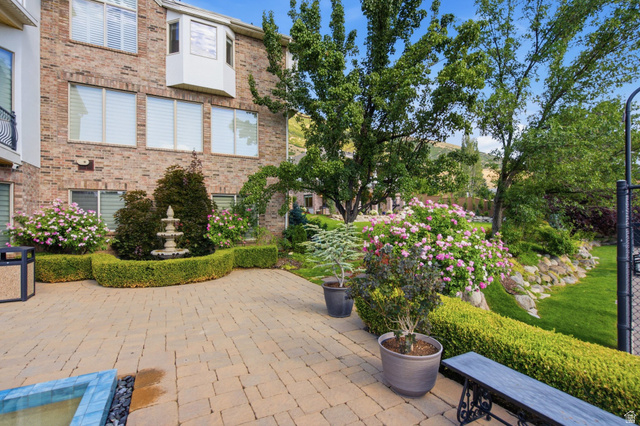 12308 Mariah Circle Draper, UT 84020 - Photo 243 of 293 Guest House Expansive paver patio bordered by manicured hedges and flowering shrubs