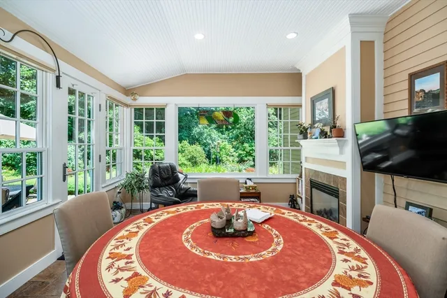a dining room with furniture window and outside view