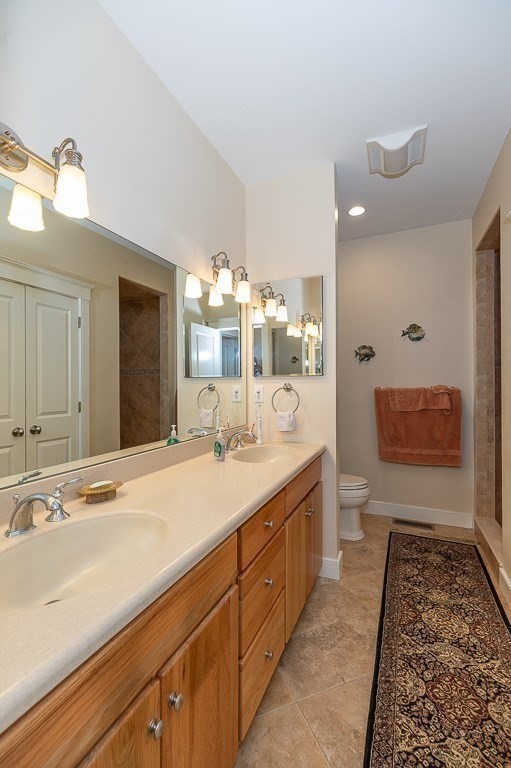 12 Wallis Drive, Unit 12 Wenham, MA 01984 - Photo 16 of 35 a spacious bathroom with a granite countertop sink and a mirror