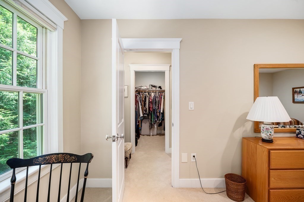 12 Wallis Drive, Unit 12 Wenham, MA 01984 - Photo 19 of 35 a view of hallway with wooden floor and furniture