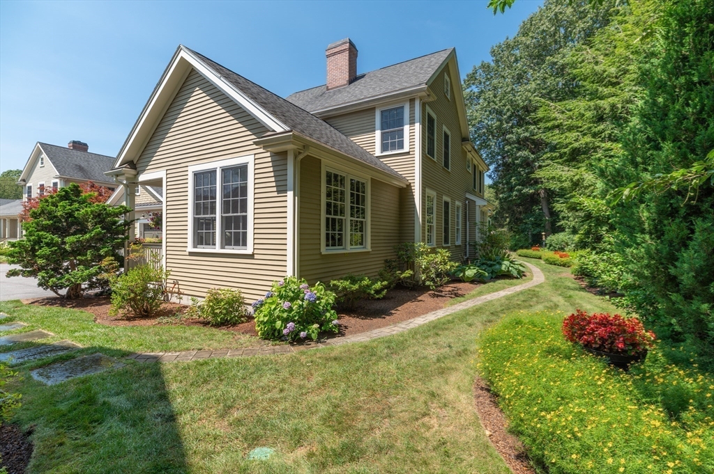 12 Wallis Drive, Unit 12 Wenham, MA 01984 - Photo 24 of 35 a front view of a house with garden