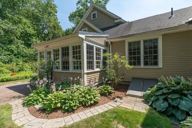 a living room with lots of furniture and clutter