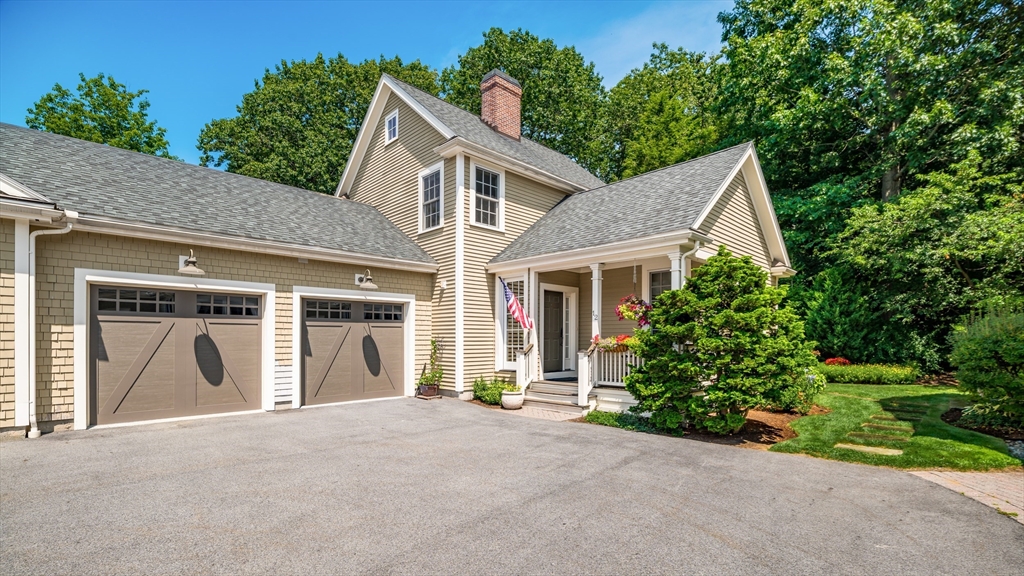 12 Wallis Drive, Unit 12 Wenham, MA 01984 - Photo 3 of 35 a view of a house with a yard and garage