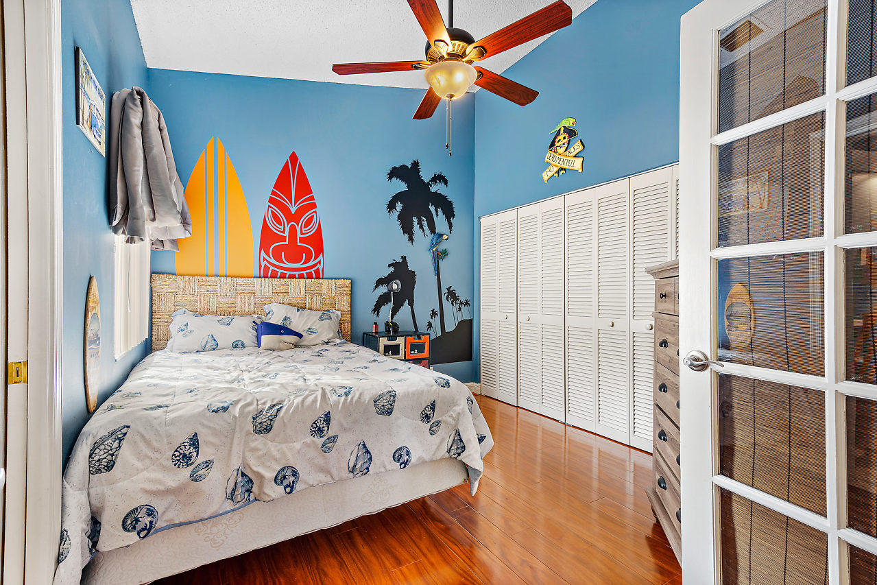 23122 Island View, Unit 6 Boca Raton, FL 33433 - Photo 17 of 38 a bedroom with a bed and a window