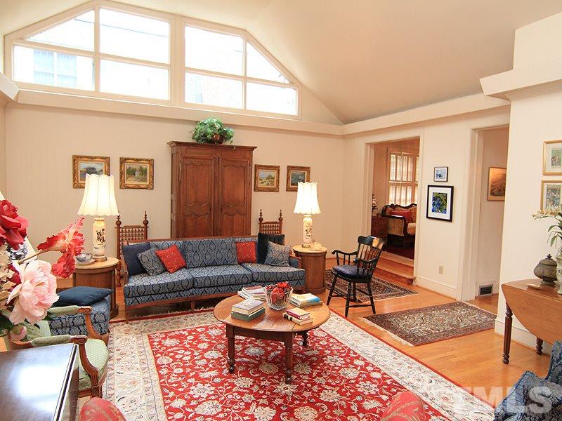 2009 Banbury Road Raleigh, NC 27608 - Photo 3 of 24 a living room with furniture a rug and a window