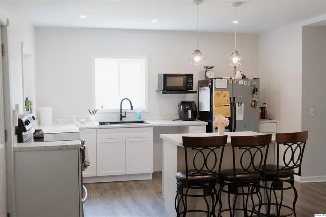 a kitchen with a sink cabinets and window