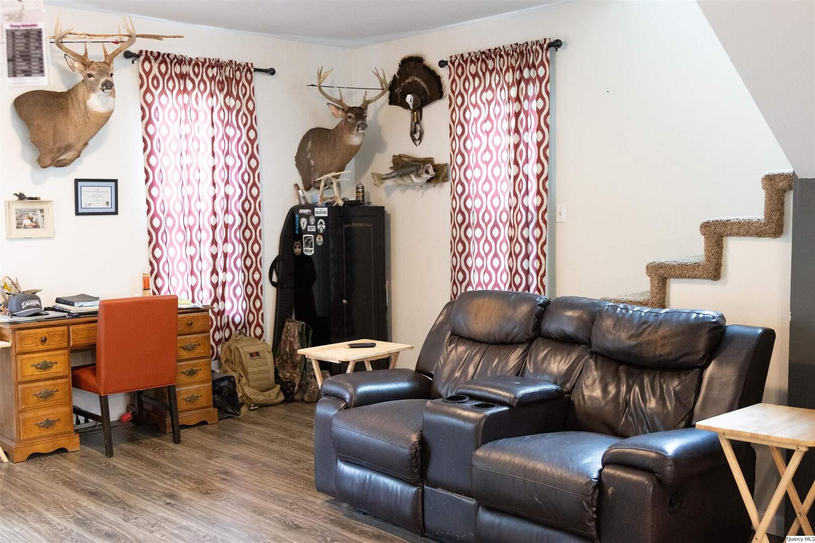 410 South Park Street Golden, IL 62339 - Photo 5 of 12 a living room with furniture and wooden floor