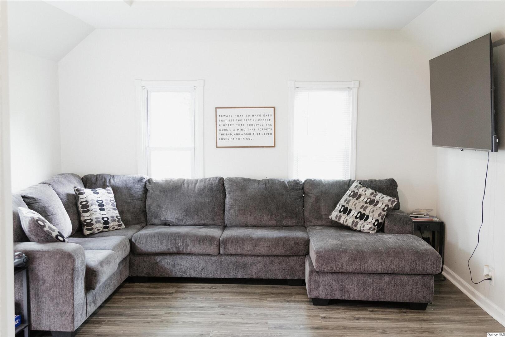 410 South Park Street Golden, IL 62339 - Photo 7 of 12 a living room with furniture a flat screen tv and a couch