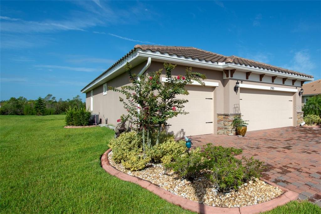 795 San Raphael Street Poinciana, FL 34759 - Photo 1 of 1 a view of a house with a yard