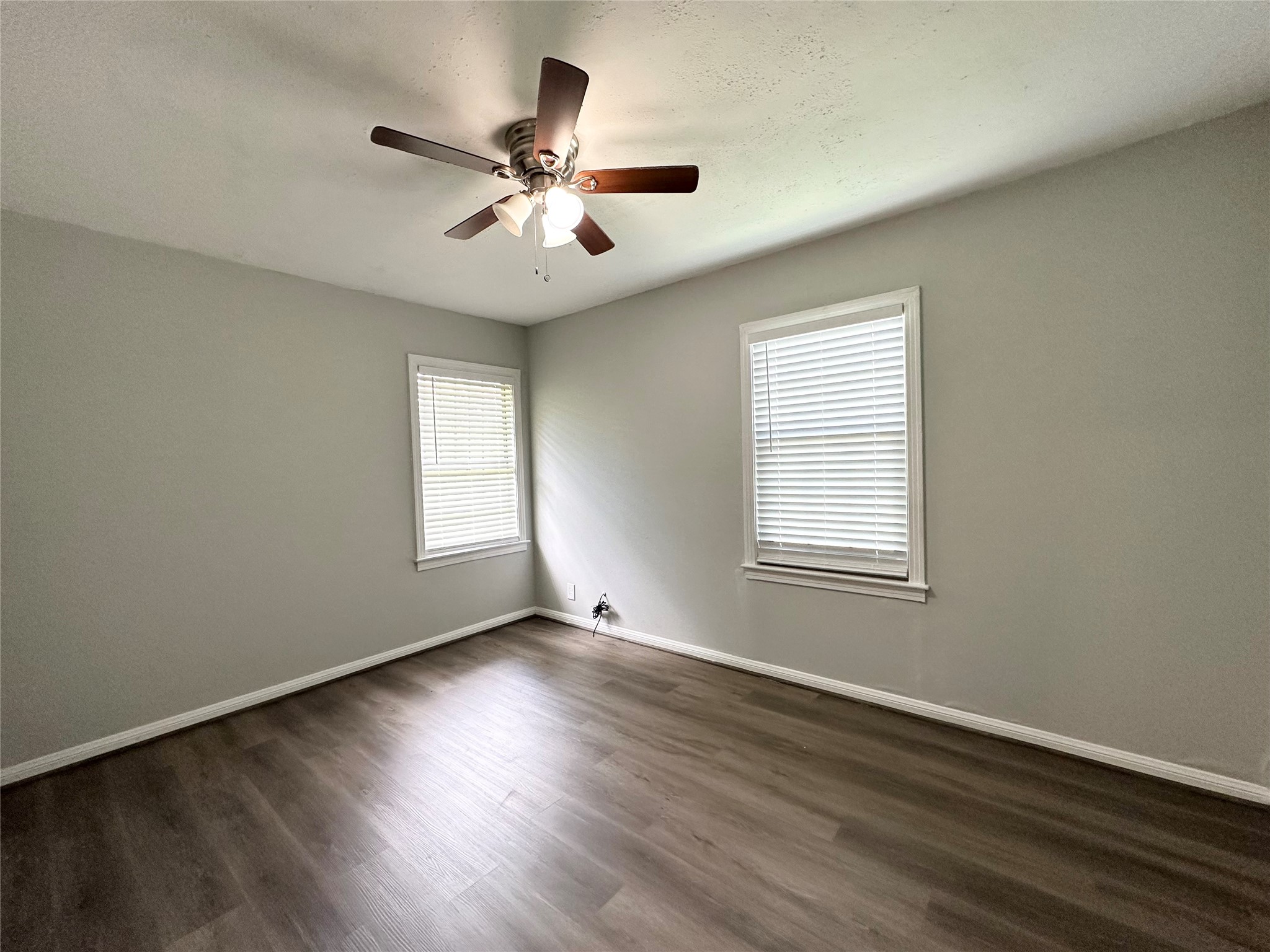 3723 Cosby Street Houston, TX 77021 - Photo 9 of 14 a view of an empty room with wooden floor and a window