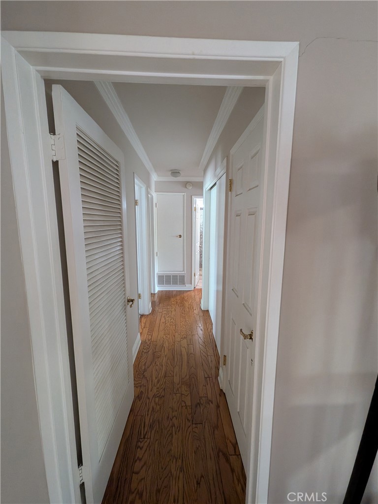 15739 Lone Ridge Place La Mirada, CA 90638 - Photo 16 of 39 a view of a hallway with wooden floor and staircase