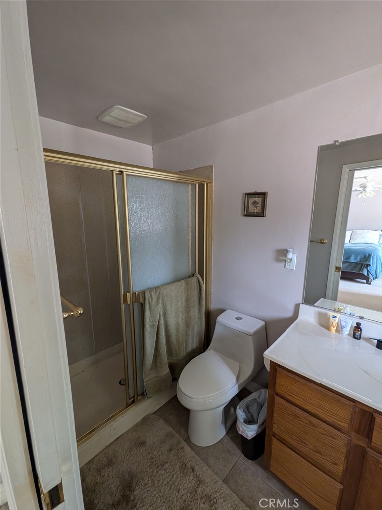 15739 Lone Ridge Place La Mirada, CA 90638 - Photo 25 of 39 a bathroom with a toilet a sink and shower