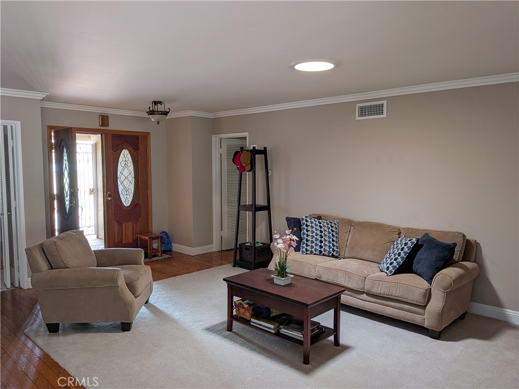 15739 Lone Ridge Place La Mirada, CA 90638 - Photo 3 of 39 a living room with furniture and a mirror