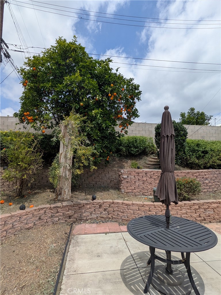 15739 Lone Ridge Place La Mirada, CA 90638 - Photo 31 of 39 a table and chairs sitting in the middle of a yard