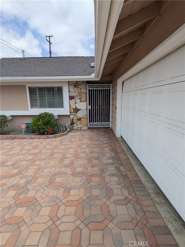 15739 Lone Ridge Place La Mirada, CA 90638 - Photo 37 of 39 a view of backyard with a chair and potted plants