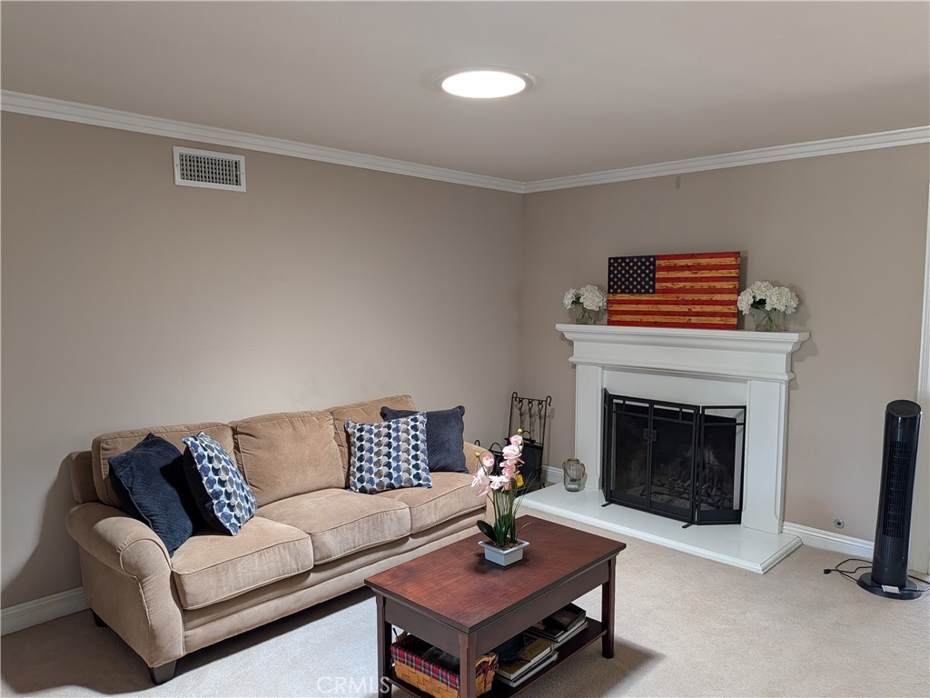 15739 Lone Ridge Place La Mirada, CA 90638 - Photo 5 of 39 a living room with furniture and a fireplace