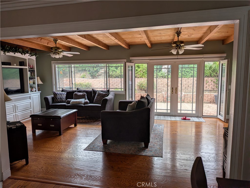 15739 Lone Ridge Place La Mirada, CA 90638 - Photo 6 of 39 a living room with furniture and a flat screen tv