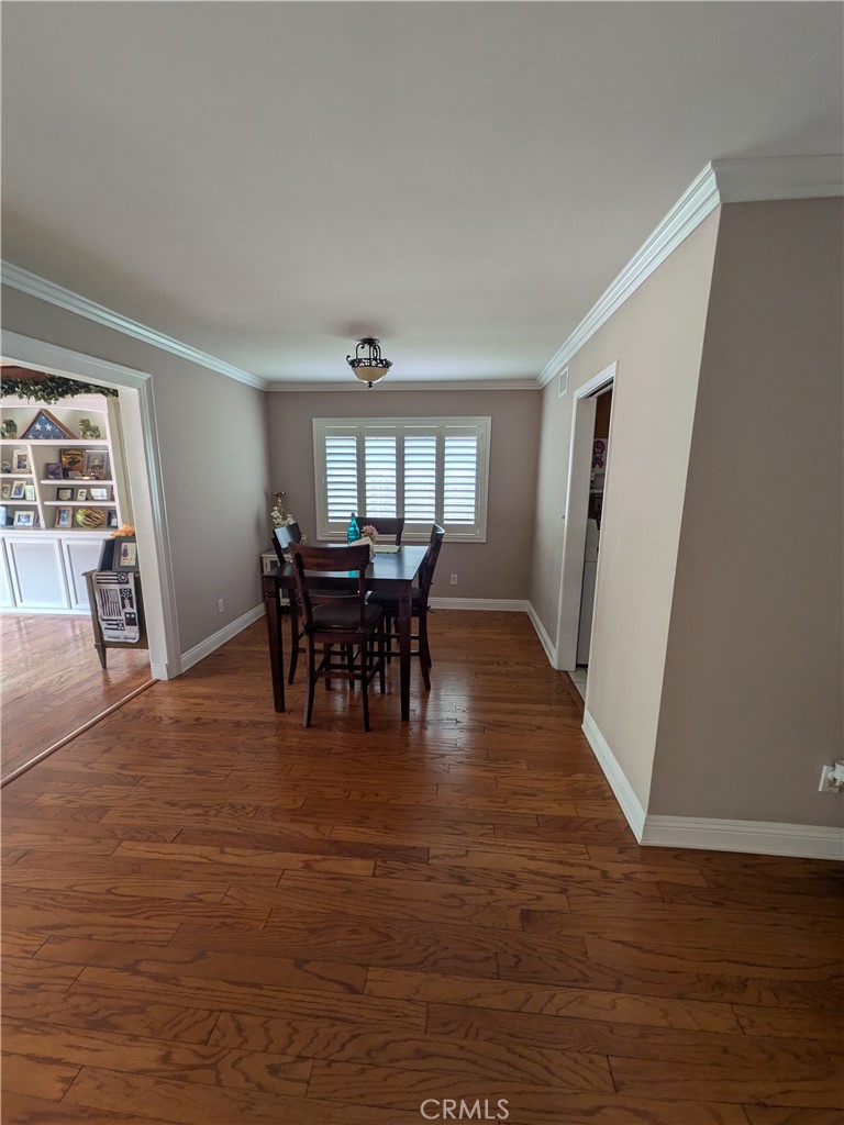15739 Lone Ridge Place La Mirada, CA 90638 - Photo 9 of 39 a view of a dining room with furniture window and wooden floor