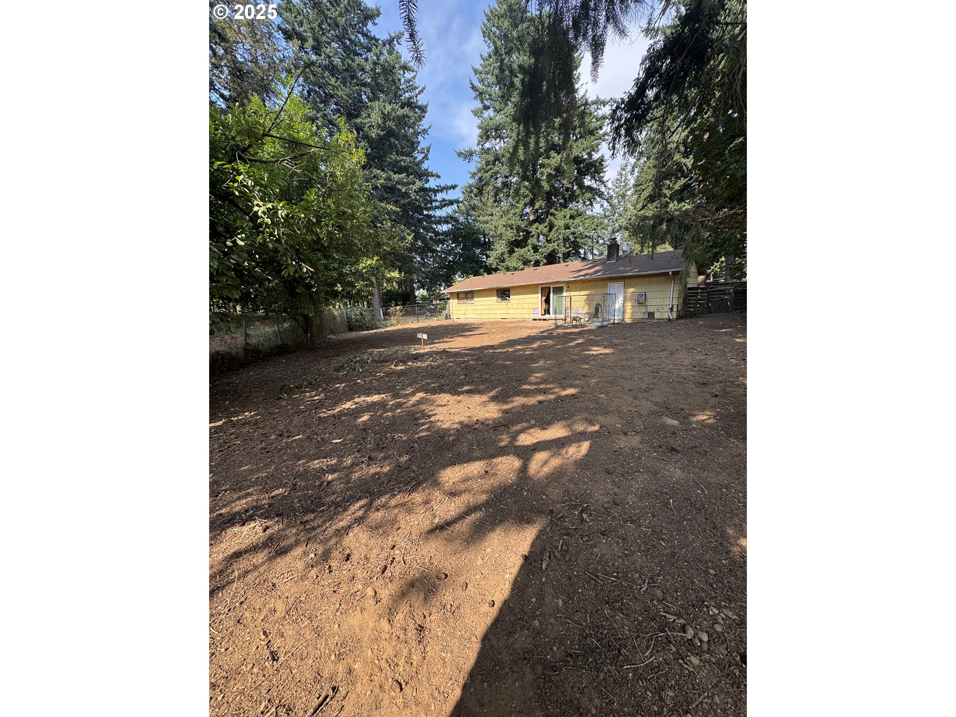 18640 Southeast Yamhill Circle Portland, OR 97233 - Photo 4 of 10 a view of a yard with trees
