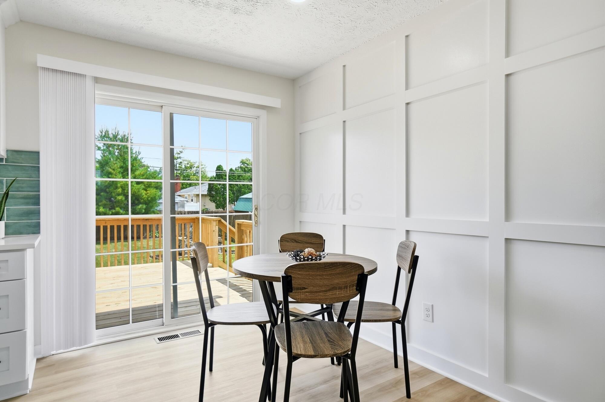 142 Gladys Road Columbus, OH 43228 - Photo 8 of 43 Kitchen Eating Area/Deck Entry