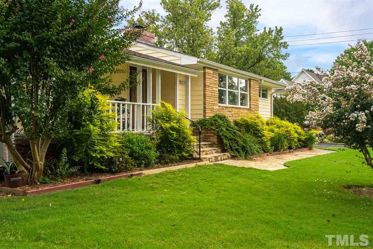 5270 Six Forks Road Raleigh, NC 27609 - Photo 1 of 30 a view of an house with backyard space and garden
