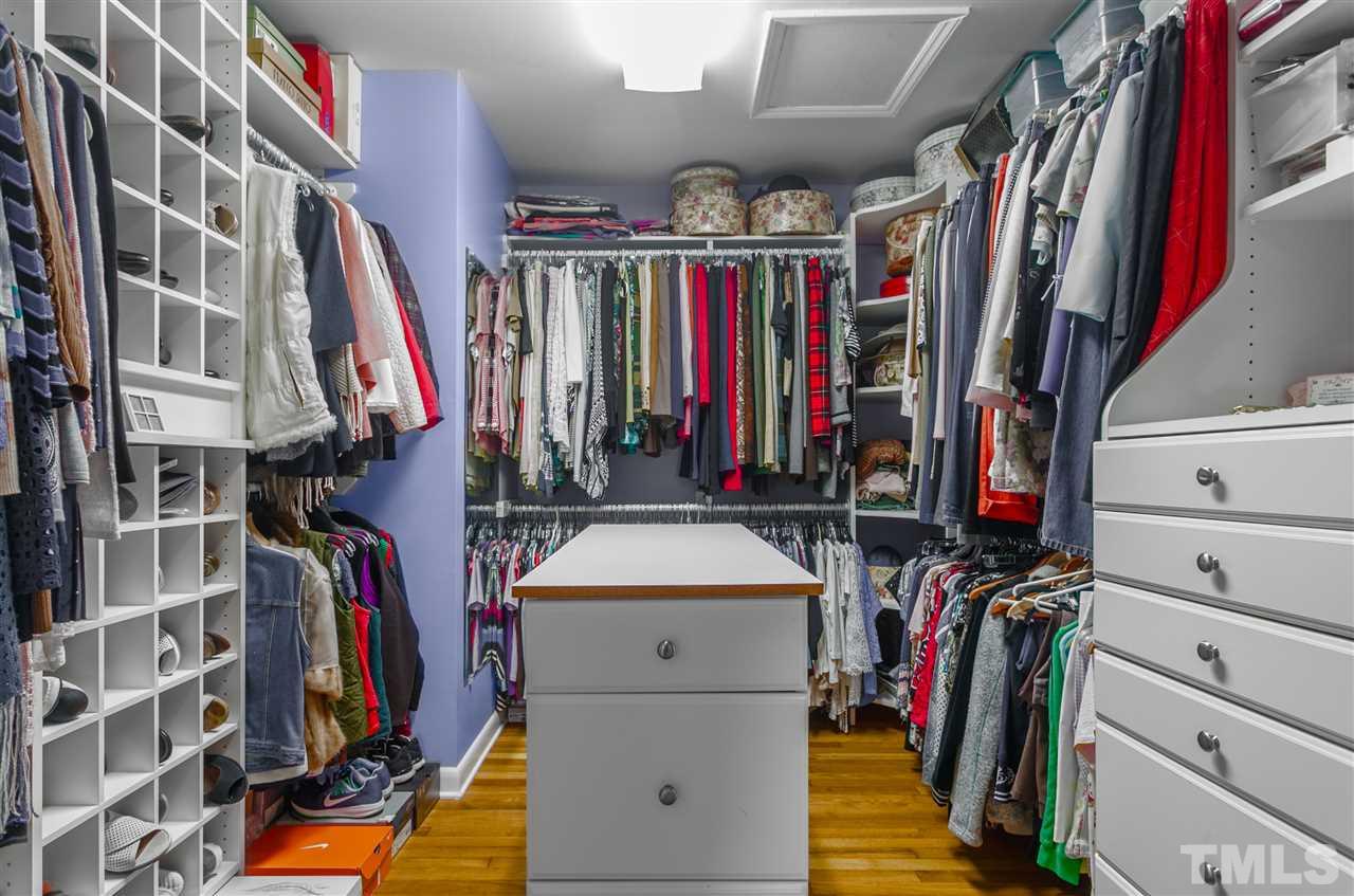 5270 Six Forks Road Raleigh, NC 27609 - Photo 22 of 30 a view of walk in closet with clothes and shoes