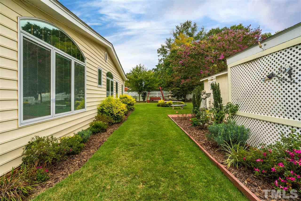 5270 Six Forks Road Raleigh, NC 27609 - Photo 4 of 30 a view of a backyard with potted plants