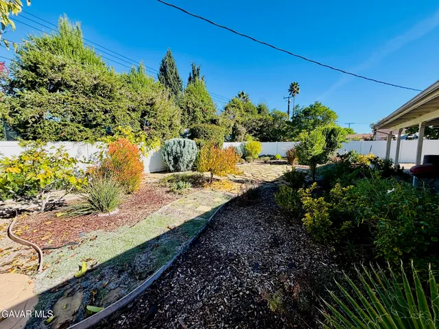an aerial view of a house with a garden