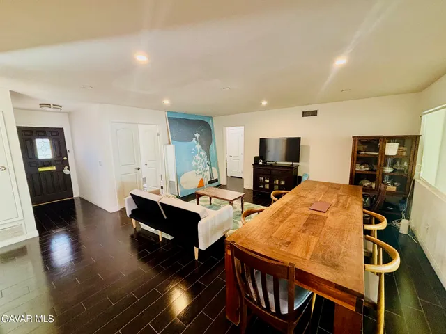 a large kitchen with a table and chairs in it