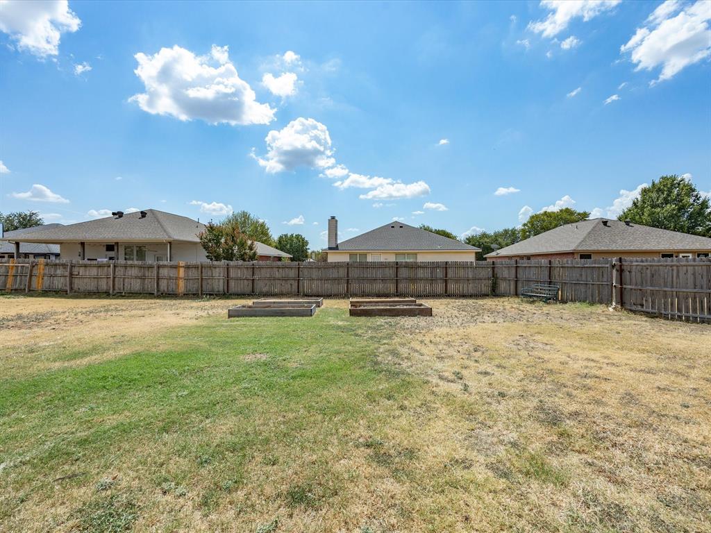 233 Kingsway Court Rhome, TX 76078 - Photo 17 of 19 Raised garden beds