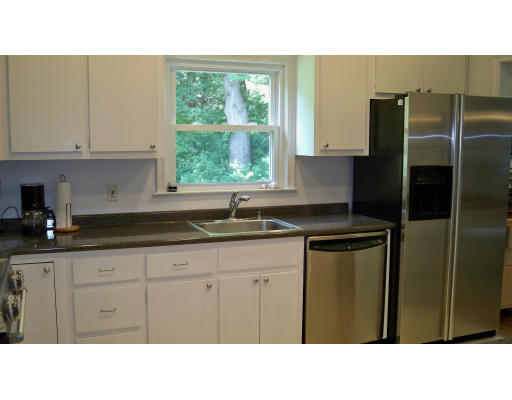 35 Marked Tree Road Sudbury, MA 01776 - Photo 7 of 12 a kitchen with a sink a refrigerator and window