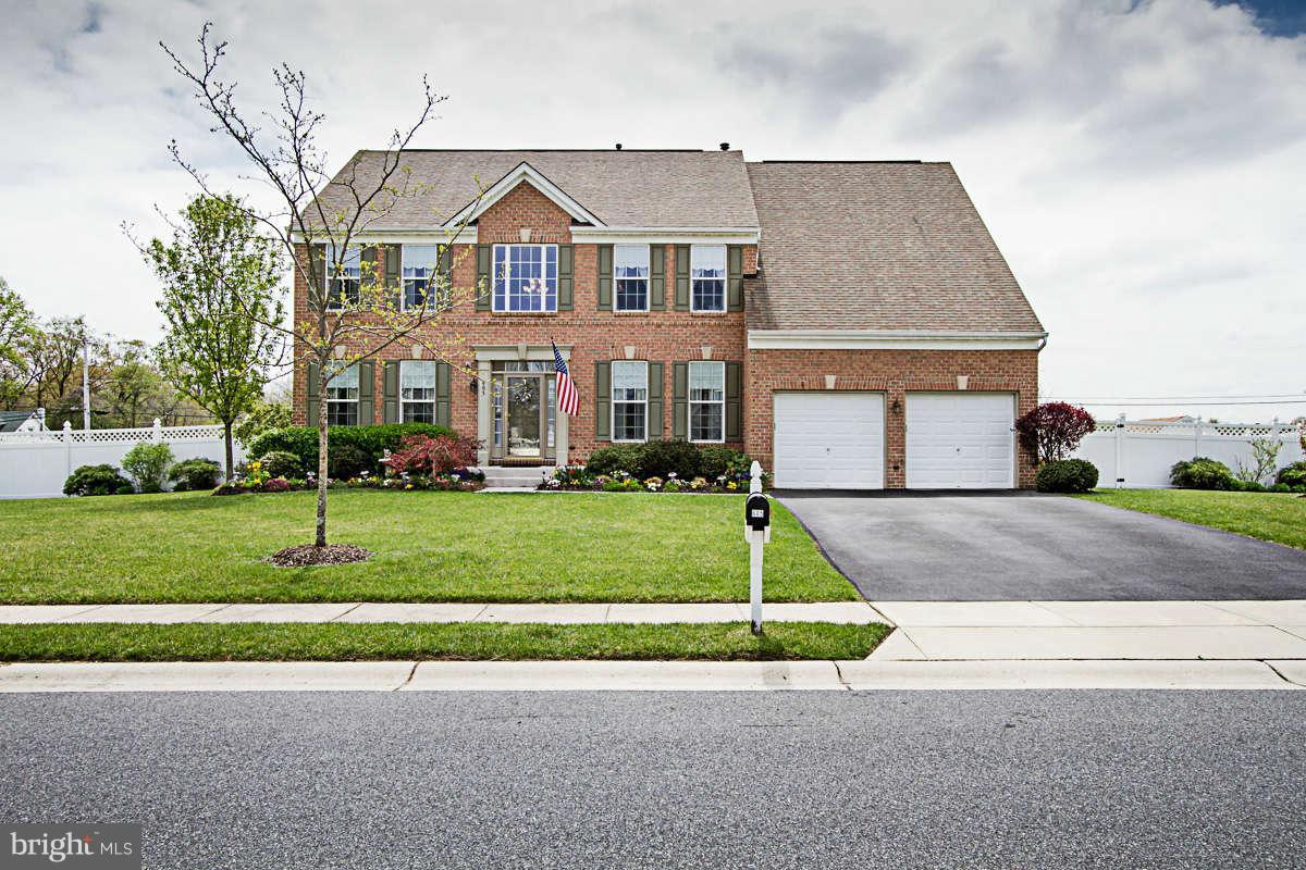 605 Sand Road Severn, MD 21144 - Photo 1 of 30 a front view of a house with a yard