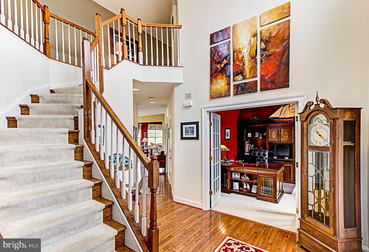 605 Sand Road Severn, MD 21144 - Photo 2 of 30 a view of entryway and hall with wooden floor
