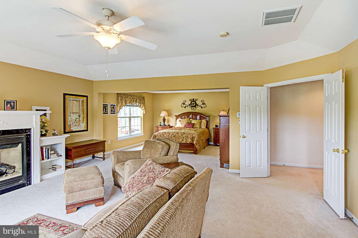 605 Sand Road Severn, MD 21144 - Photo 13 of 30 a living room with furniture and a fireplace