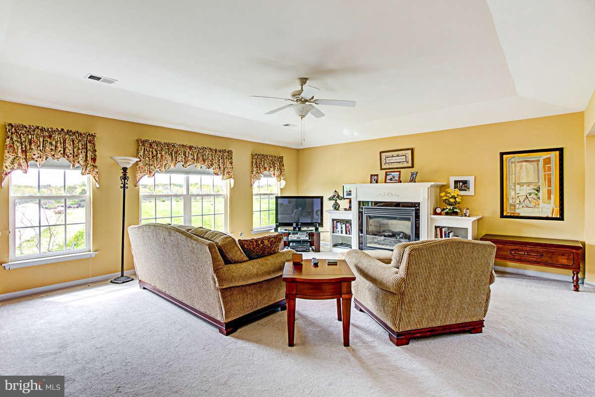605 Sand Road Severn, MD 21144 - Photo 14 of 30 a living room with fireplace furniture and a window